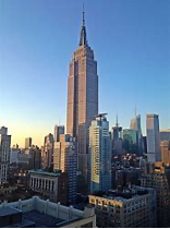 The Empire State Building at dusk, seen across Manhattan